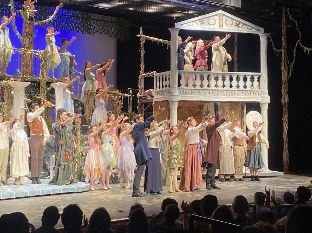 On opening night, the actors thank the tech crew. After their own bows, the actors raise their hands to the light and sound crew.